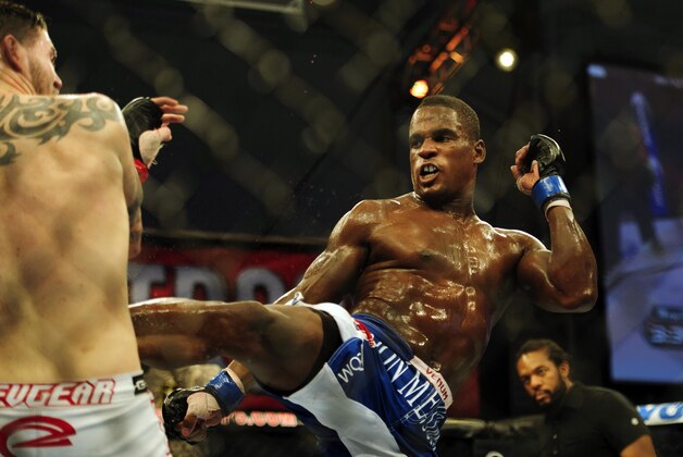 Nov 6, 2013; Fort Campbell, KY, USA; Chris Camozzi (red gloves) fights Lorenz Larkin (blue gloves) in the middleweight bout during UFC Fight for the Troops at Fort Campbell. Mandatory Credit: Joshua Lindsey-USA TODAY Sports