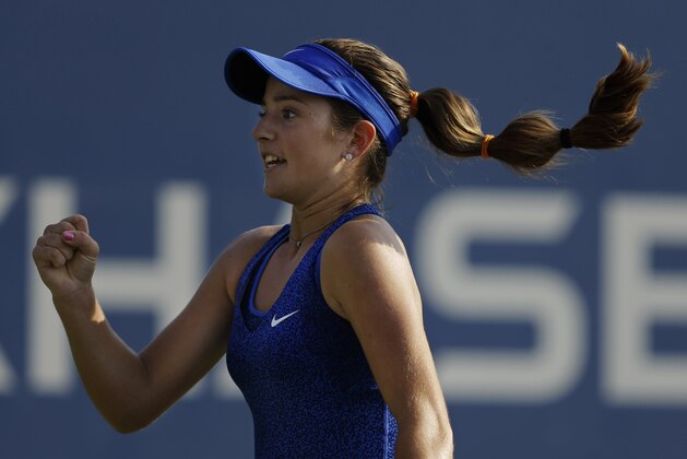 Catherine Bellis, of the United States, reacts after a point against Dominika Cibulkova, of Slovakia, during the first round of the 2014 U.S. Open tennis tournament, Tuesday, Aug. 26, 2014, in New York. (AP Photo/Darron Cummings)