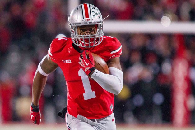 Nov 23, 2013; Columbus, OH, USA;  Ohio State Buckeyes running back Dontre Wilson (1) runs with the ball and scores a touchdown in the third quarter of the game against the Indiana Hoosiers at Ohio Stadium. Ohio State Buckeyes beat Indiana Hoosiers 42-14. Mandatory Credit: Trevor Ruszkowksi-USA TODAY Sports