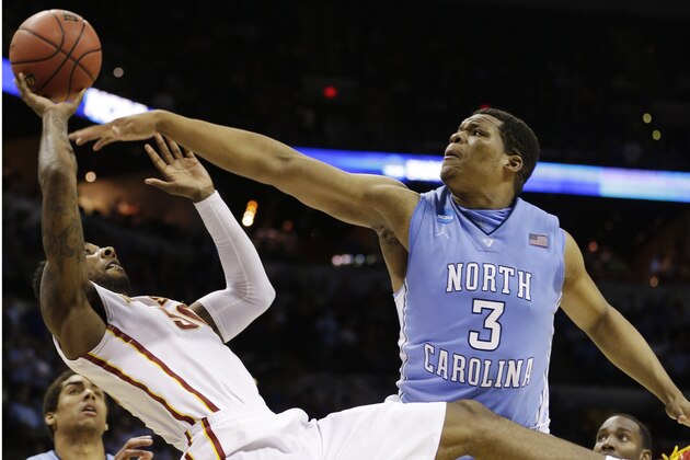 Iowa State guard DeAndre Kane (50) tries to shoot as North Carolina forward Kennedy Meeks (3) defends during the second half of a third-round game in the NCAA college basketball tournament Sunday, March 23, 2014, in San Antonio. (AP Photo/David J. Phillip)