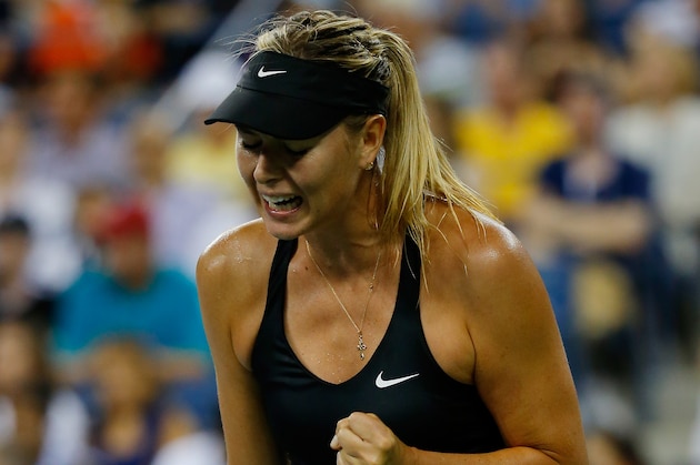 NEW YORK, NY - AUGUST 25:  Maria Sharapova of Russia reacts against Maria Kirilenko of Russia during their women's singles match on Day One of the 2014 US Open at the USTA Billie Jean King National Tennis Center on August 25, 2014 in the Flushing neighborhood of the Queens borough of New York City.  (Photo by Chris Trotman/Getty Images for USTA)