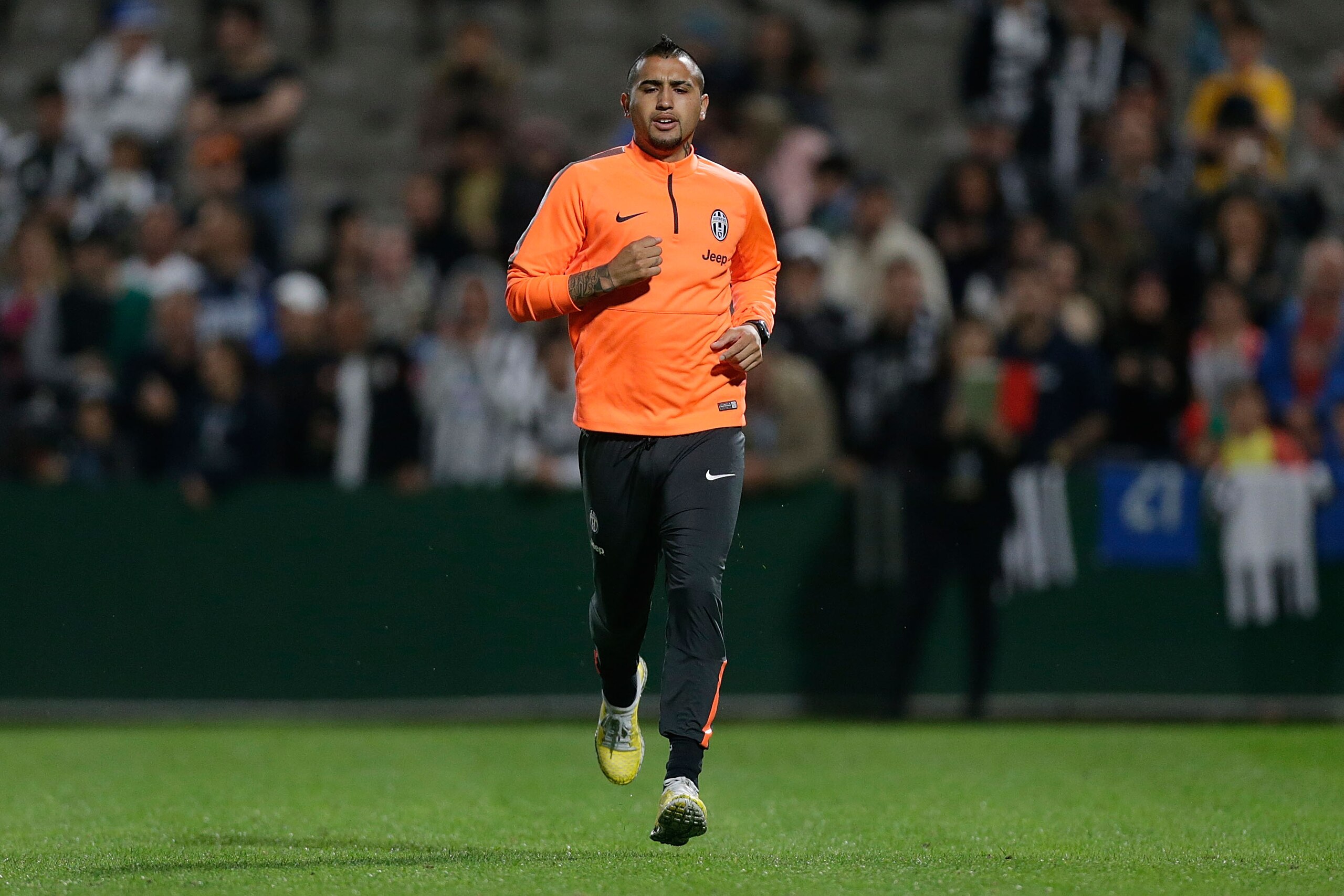 SYDNEY, AUSTRALIA - AUGUST 09:  Arturo Vidal runs during a Juventus training session at WIN Jubilee Stadium on August 9, 2014 in Sydney, Australia.  (Photo by Mark Metcalfe/Getty Images)