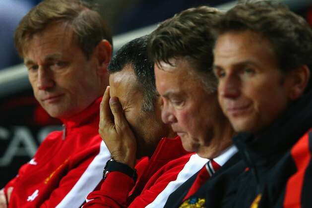 MILTON KEYNES, ENGLAND - AUGUST 26:  Assistant manager Ryan Giggs looks dejected with manager Louis van Gaal of Manchester United during the Capital One Cup Second Round match between MK Dons and Manchester United at Stadium mk on August 26, 2014 in Milton Keynes, England.  (Photo by Clive Mason/Getty Images)