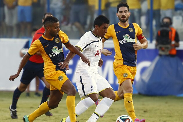 LARNACA, CYPRUS - AUGUST 21:  Jose Paulo Bezzera Jr  (C) from Tottenham Hotspur fights for the ball during the AEL Limassol FC v  Tottenham Hotspur - UEFA Europa League Qualifying Play-Off match on August 21, 2014 in Larnaca, Cyprus.  (Photo by Andrew Caballero-Reynolds/Getty Images)