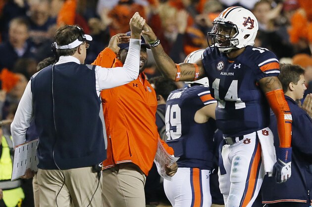 AUBURN, AL - NOVEMBER 30:  Nick Marshall #14 celebrates with head coach Gus Malzahn of the Auburn Tigers in the fourth quarter against the Alabama Crimson Tide at Jordan-Hare Stadium on November 30, 2013 in Auburn, Alabama.  (Photo by Kevin C. Cox/Getty Images)
