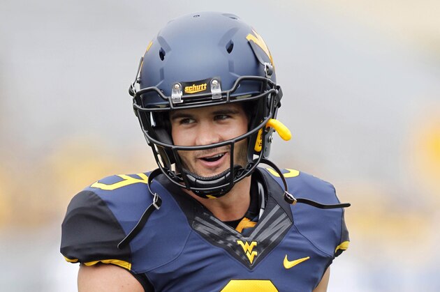 Aug 31, 2013; Morgantown, WV, USA; West Virginia Mountaineers quarterback Clint Trickett (9) on the field before playing the William & Mary Tribe at Milan Puskar Stadium. Mandatory Credit: Charles LeClaire-USA TODAY Sports