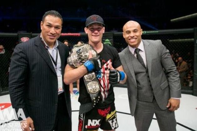 Rick Glenn (center) after winning the WSOF featherweight belt. Rick Glenn (center) after winning the WSOF featherweight belt.
