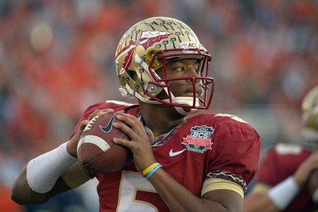 Florida State quarterback Jameis Winston (5) warms up before the NCAA BCS National Championship college football game against Auburn, Monday, Jan. 6, 2014, in Pasadena, Calif. (AP Photo/Mark J. Terrill)