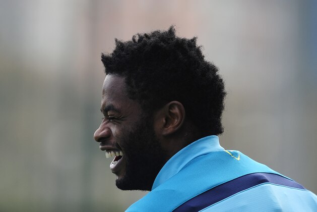 Barcelona's Alex Song smiles during a training session at the Sports Center FC Barcelona Joan Gamper in San Joan Despi, Spain, Friday, Feb. 14, 2014. (AP Photo/Manu Fernandez)