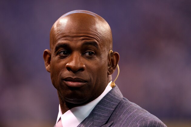 INDIANAPOLIS, IN - FEBRUARY 05:  Deion Sanders of the NFL Network watches warmups on the field before the New England Patriots take on the New York Giants in Super Bowl XLVI at Lucas Oil Stadium on February 5, 2012 in Indianapolis, Indiana.  (Photo by Elsa/Getty Images)