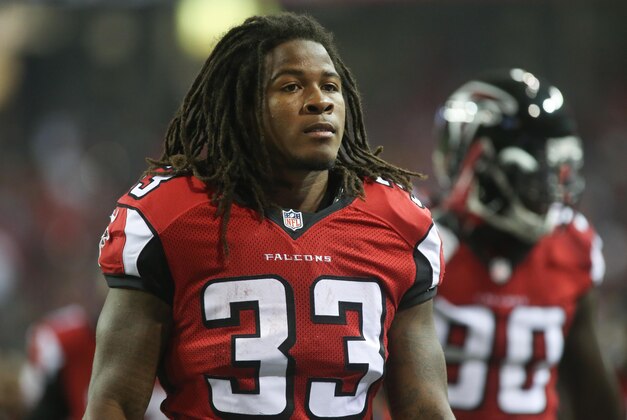 Aug 23, 2014; Atlanta, GA, USA; Atlanta Falcons running back Devonta Freeman (33) jogs toward the locker room after the first half of their game against the Tennessee Titans at the Georgia Dome. The Titans won 24-17. Mandatory Credit: Jason Getz-USA TODAY Sports