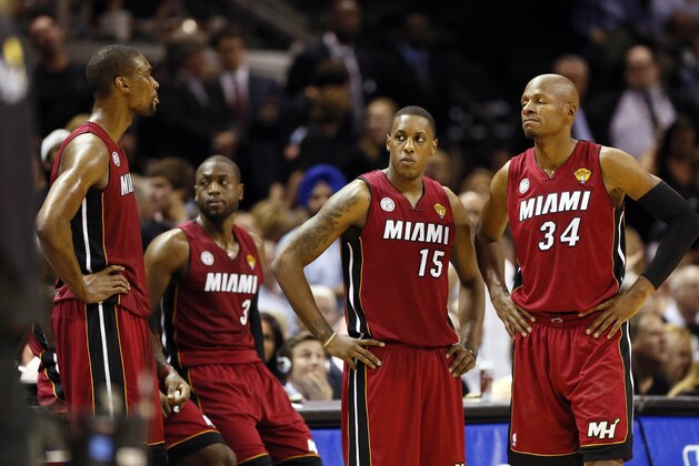 Jun 11, 2013; San Antonio, TX, USA; From left to right, center Chris Bosh, shooting guard Dwyane Wade, point guard Mario Chalmers, and shooting guard Ray Allen react during the fourth quarter of game three of the 2013 NBA Finals against the San Antonio Spurs at the AT&T Center.  Mandatory Credit: Soobum Im-USA TODAY Sports
