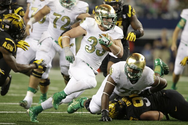Notre Dame running back Cam McDaniel (33) finds an opening during the first half of an NCAA college football game Arizona State Saturday, Oct. 5, 2013, in Arlington, Texas. (AP Photo/LM Otero)