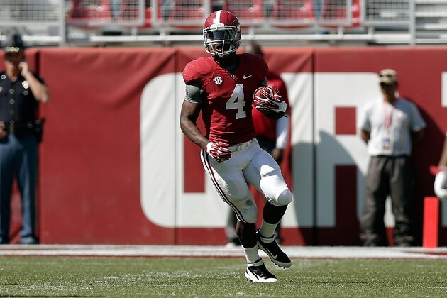 TUSCALOOSA, AL - APRIL 19: T.J. Yeldon #4 of the Crimson team runs for yards against the White team during the University of Alabama A-Day spring game at Bryant-Denny Stadium on April 19, 2014 in Tuscaloosa, Alabama.  (Photo by Stacy Revere/Getty Images)