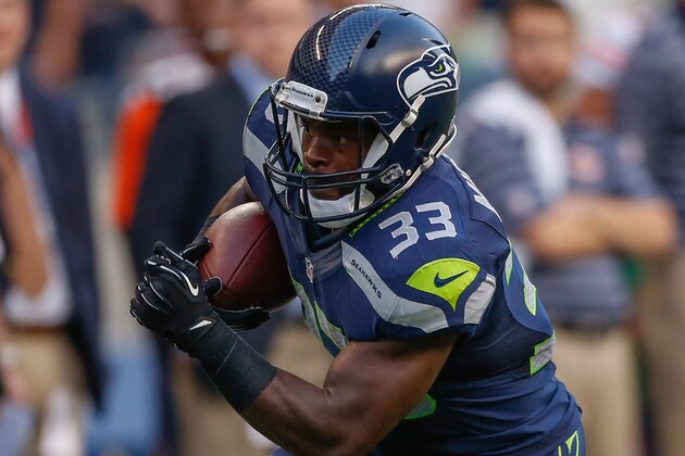 SEATTLE, WA - AUGUST 22:  Running back Christine Michael #33 of the Seattle Seahawks rushes against the Chicago Bears at CenturyLink Field on August 22, 2014 in Seattle, Washington.  (Photo by Otto Greule Jr/Getty Images)
