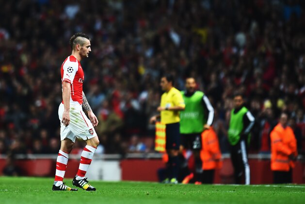 LONDON, ENGLAND - AUGUST 27:  Mathieu Debuchy of Arsenal is sent off by match referee Pedro Proenca during the UEFA Champions League Qualifier 2nd leg match between Arsenal and Besiktas at the Emirates Stadium on August 27, 2014 in London, United Kingdom.  (Photo by Shaun Botterill/Getty Images)