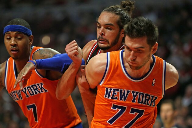 CHICAGO, IL - OCTOBER 31: Joakim Noah #13 of the Chicago Bulls battles for position on a free-throw with Carmelo Anthony #7 (L) and Andrea Bargnani #77 of the New York Knicks at the United Center on October 31, 2013 in Chicago, Illinois. The Bulls defeated the Knicks 82-81. NOTE TO USER: User expressly acknowledges and agrees that, by downloading and or using this photograph, User is consenting to the terms and conditions of the Getty Images License Agreement. (Photo by Jonathan Daniel/Getty Images)