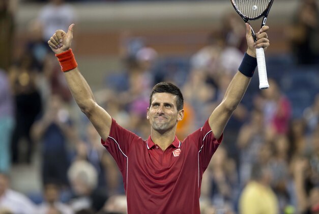 Aug 25, 2014; New York, NY, USA; Novak Djokovic (SRB) celebrates recording match point in his match against Diego Schwartzman (ARG) on day one of the 2014 U.S. Open tennis tournament at USTA Billie Jean King National Tennis Center. Mandatory Credit: Susan Mullane-USA TODAY Sports