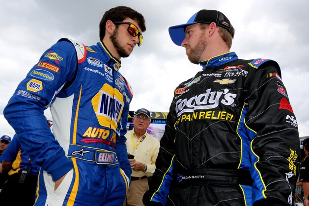 DAYTONA BEACH, FL - JULY 04: Chase Elliott (L), driver of the #9 Napa Auto Parts Chevrolet, talks to Regan Smith, driver of the #7 Goody's Chevrolet, on the grid during qualifying for the NASCAR Nationwide Series Subway Firecracker 250 at Daytona International Speedway on July 4, 2014 in Daytona Beach, Florida.  (Photo by Jerry Markland/Getty Images)