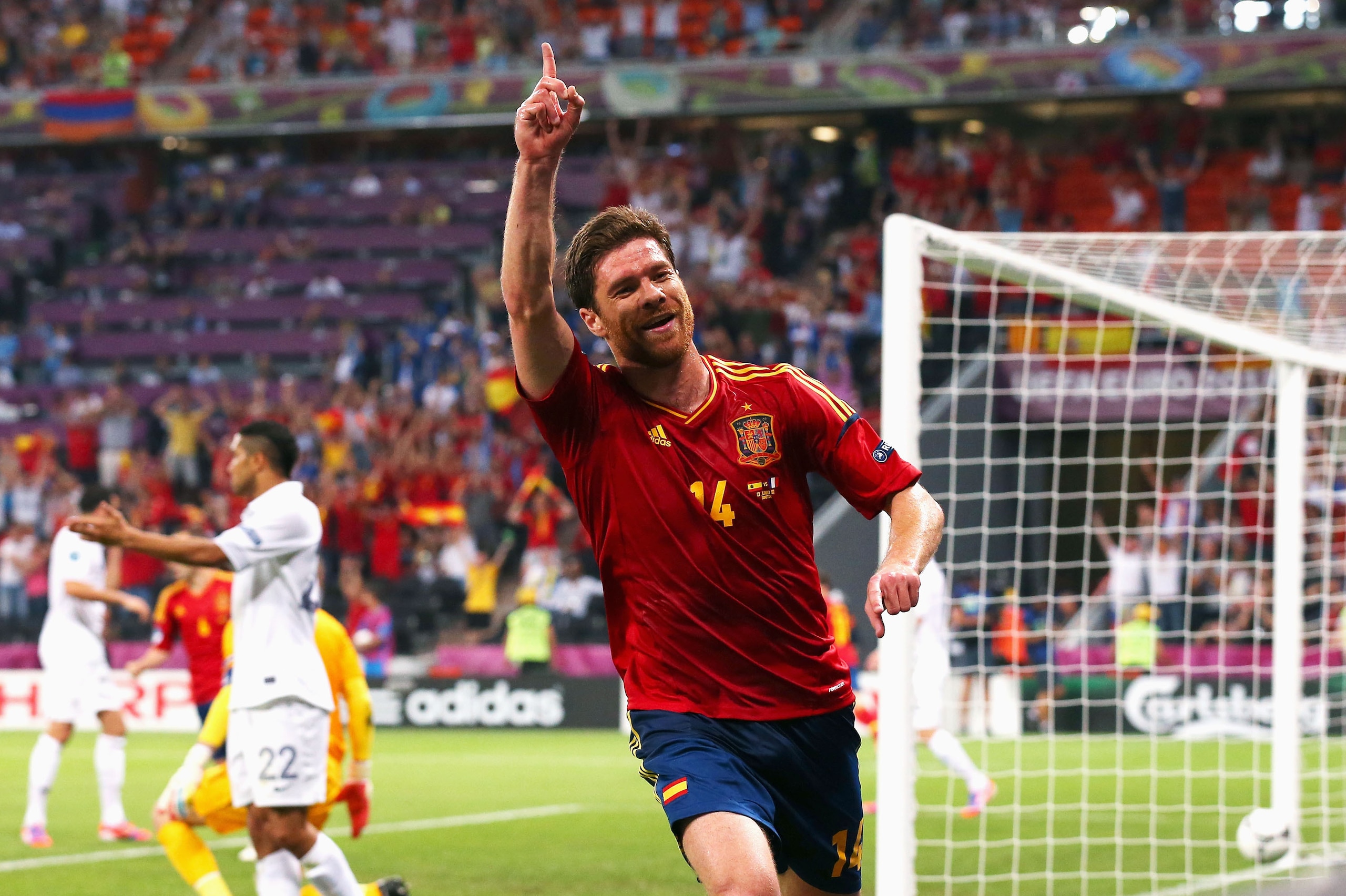 DONETSK, UKRAINE - JUNE 23:  Xabi Alonso of Spain celebrates after scoring the first goal during the UEFA EURO 2012 quarter final match between Spain and France at Donbass Arena on June 23, 2012 in Donetsk, Ukraine.  (Photo by Alex Livesey/Getty Images)