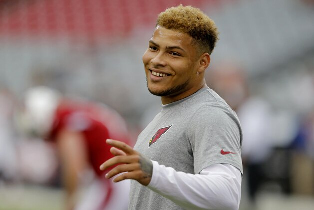 Arizona Cardinals free safety Tyrann Mathieu warms up prior to an NFL preseason football game against the Cincinnati Bengals, Sunday, Aug. 24, 2014, in Glendale, Ariz. (AP Photo/Rick Scuteri)