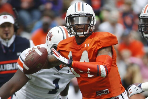 Auburn quarterback Nick Marshall (14) throws in the first half of the annual A Day spring inter squad college football game  Saturday, April 19, 2014 in Auburn, Ala.  (AP Photo/John Bazemore)