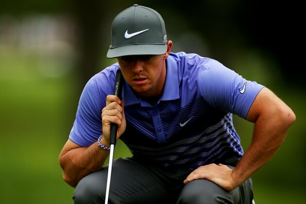 PARAMUS, NJ - AUGUST 24:  Rory McIlroy of Northern Ireland lines up a putt on the 14th green during the final round of The Barclays at The Ridgewood Country Club on August 24, 2014 in Paramus, New Jersey.  (Photo by Darren Carroll/Getty Images)