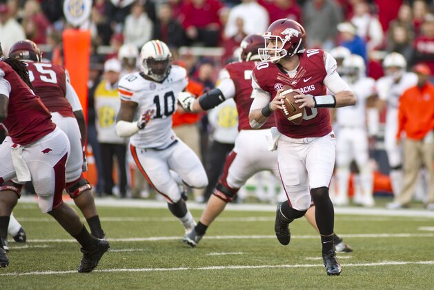 Arkansas quarterback Brandon Allen (10) makes a pass as Auburn cornerback Chris Davis (10) pursues during an NCAA college football game in Fayetteville, Ark., Saturday, Nov. 2, 2013. Auburn defeated Arkansas 35-17. (AP Photo/Beth Hall)