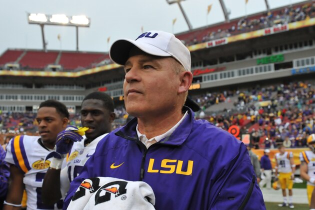 TAMPA, FL -  JANUARY 1:  Coach Les Miles of the LSU Tigers waits for an end-of-game official's ruling before celebrating a 21 - 14 victory against the Iowa Hawkeyes January 1, 2014 in the Outback Bowl at Raymond James Stadium in Tampa, Florida.  LSU won 21 - 14. (Photo by Al Messerschmidt/Getty Images)