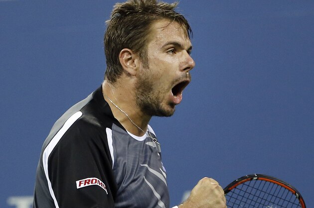 Stan Wawrinka, of Switzerland, reacts after winning a point against Thomaz Bellucci, of Brazil, during the second round of the U.S. Open tennis tournament Wednesday, Aug. 27, 2014, in New York. (AP Photo/Jason DeCrow)