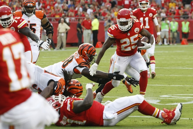 Kansas City Chiefs running back Jamaal Charles (25) runs against Cincinnati Bengals defense in the first half of an NFL preseason football game Thursday, Aug. 7, 2014, in Kansas City, Mo. (AP Photo/Colin E. Braley)