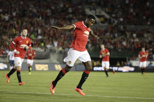 Manchester United's Danny Welbeck celebrates after scoring against the Los Angeles Galaxy during the first half of a friendly soccer match at Rose Bowl on Wednesday, July 23, 2014, in Pasadena, Calif. (AP Photo)