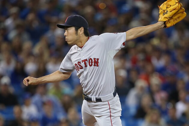 TORONTO, CANADA - AUGUST 25: Koji Uehara #19 of the Boston Red Sox delivers a pitch in the ninth inning during MLB game action against the Toronto Blue Jays on August 25, 2014 at Rogers Centre in Toronto, Ontario, Canada. (Photo by Tom Szczerbowski/Getty Images)