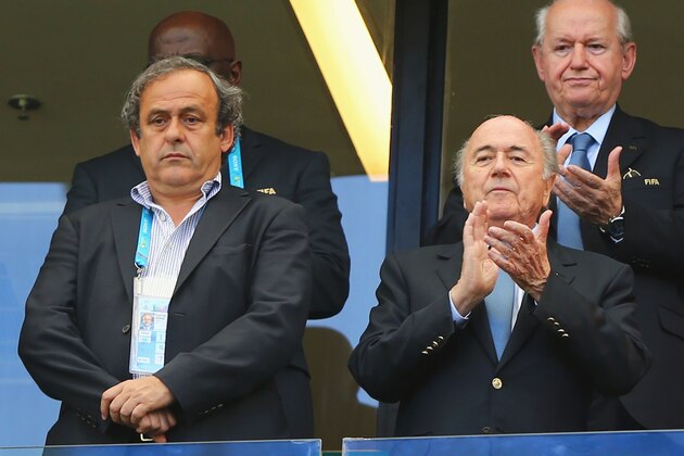 SALVADOR, BRAZIL - JUNE 16:  UEFA President Michel Platini (L) and FIFA President Joseph Blatter look on during the 2014 FIFA World Cup Brazil Group G match between Germany and Portugal at Arena Fonte Nova on June 16, 2014 in Salvador, Brazil.  (Photo by Martin Rose/Getty Images)