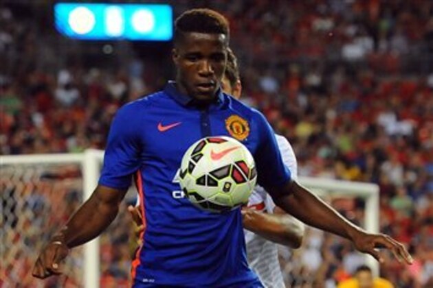 IMAGE DISTRIBUTED FOR GUINNESS INTERNATIONAL CHAMPIONS CUP - Manchester United midfielder Wilfried Zaha (29) battles for possession during a match between Inter Milan and Manchester United in the 2014 Guinness International Champions Cup on Tuesday, July 29, 2014 in Landover, Maryland. (Larry French/AP Images for Guinness International Champions Cup)