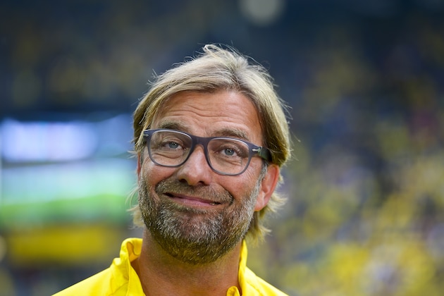 Dortmund's head coach Juergen Klopp smiles during the German soccer Super Cup match between Borussia Dortmund and Bayern Munich in Dortmund, Germany, Wednesday, Aug. 13, 2014. (AP Photo/Sascha Schuermann)