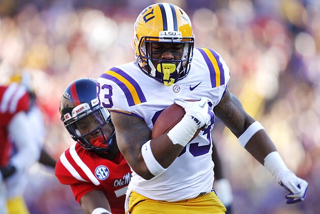 File-This Nov. 17, 2012 file photo shows LSU running back Jeremy Hill (33) rushing past Mississippi defensive back Trae Elston (7) on a 27-yard touchdown carry during the first half of their NCAA college football game, Saturday in Baton Rouge, La. A judge ruled she won't send Hill to jail for a probation violation last spring, a ruling that leaves it up to coach Les Miles to decide whether the Tigers' suspended leading rusher last season will return to the team. Miles did not immediately comment on the ruling or Hill's future, but players expressed hope after practice Monday Aug. 5, 2013 that Hill would return. (AP Photo/Gerald Herbert, File) File-This Nov. 17, 2012 file photo shows LSU running back Jeremy Hill (33) rushing past Mississippi defensive back Trae Elston (7) on a 27-yard touchdown carry during the first half of their NCAA college football game, Saturday in Baton Rouge, La. A judge ruled she won't send Hill to jail for a probation violation last spring, a ruling that leaves it up to coach Les Miles to decide whether the Tigers' suspended leading rusher last season will return to the team. Miles did not immediately comment on the ruling or Hill's future, but players expressed hope after practice Monday Aug. 5, 2013 that Hill would return. (AP Photo/Gerald Herbert, File)