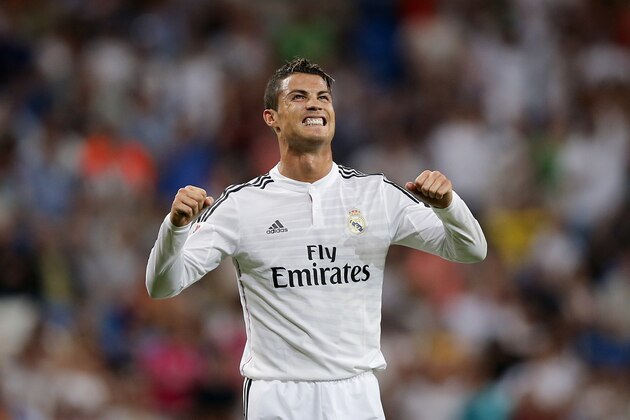 Real Madrid's Cristiano Ronaldo from Portugal celebrates his goal during a Spanish La Liga soccer match between Real Madrid and Cordoba at the Santiago Bernabeu stadium  in Madrid, Spain, Monday, Aug. 25, 2014 . (AP Photo/Daniel Ochoa de Olza)
