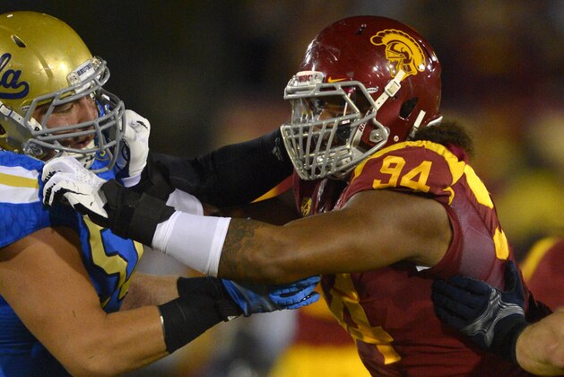 Southern California defensive end Leonard Williams, right, tries to get by UCLA guard Alex Redmond during the first half of an NCAA college football game, Saturday, Nov. 30, 2013, in Los Angeles. (AP Photo/Mark J. Terrill) Southern California defensive end Leonard Williams, right, tries to get by UCLA guard Alex Redmond during the first half of an NCAA college football game, Saturday, Nov. 30, 2013, in Los Angeles. (AP Photo/Mark J. Terrill)