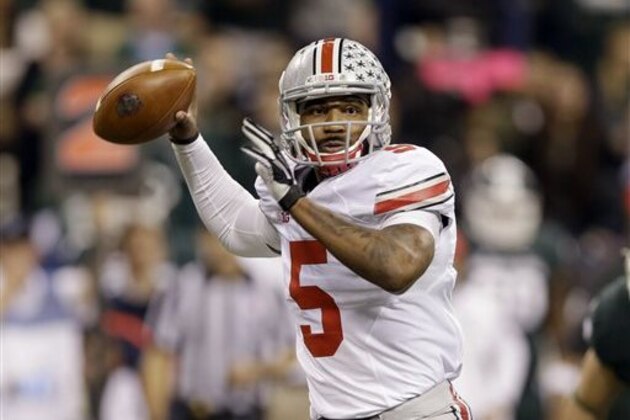 FILE - In this Dec. 7, 2013, file photo, Ohio State quarterback Braxton Miller throws a pass against Michigan State during the Big Ten Conference championship NCAA college football game in Indianapolis. Despite missing nearly three full games with a sprained knee last season, he passed for 2,094 yards and 24 touchdowns, and ran for 1,068 yards and 12 scores.  (AP Photo/Michael Conroy, File)