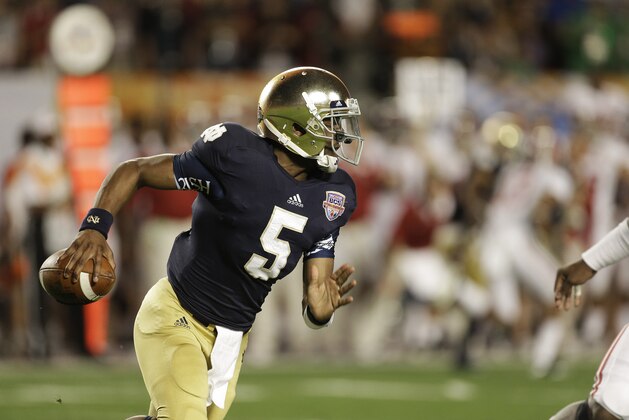 Notre Dame quarterback Everett Golson (5) works against Alabama during the first half of the BCS National Championship college football game Monday, Jan. 7, 2013, in Miami. (AP Photo/Chris O'Meara)
