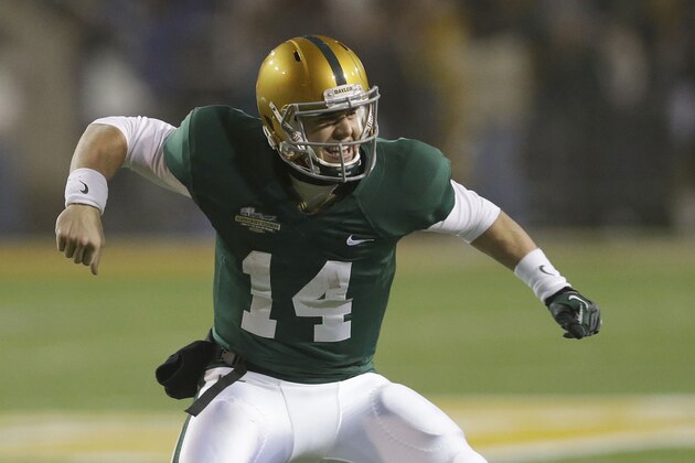 Baylor quarterback Bryce Petty (14) celebrates scoring a touchdown during the second half of an NCAA college football game against Texas Saturday, Dec. 7, 2013, in Waco, Texas. Baylor won 30-10.   (AP Photo/LM Otero)