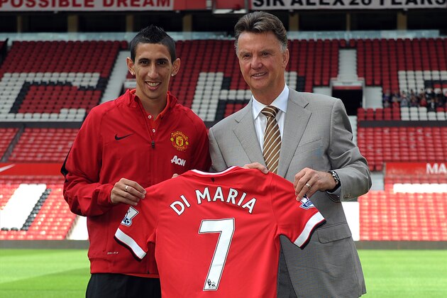 MANCHESTER, ENGLAND - AUGUST 28: Manchester United manager Louis Van Gaal poses for a photograph next to new signing Angel Di Maria at Old Trafford on August 28, 2014 in Manchester, England. (Photo by Chris Brunskill/Getty Images)