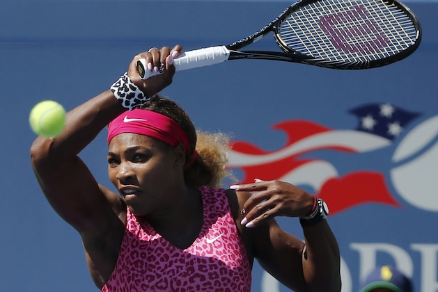 Serena Williams, of the United States, returns a shot to Vania King, of the United States, during the second round of the 2014 U.S. Open tennis tournament, Thursday, Aug. 28, 2014, in New York. (AP Photo/Elise Amendola)