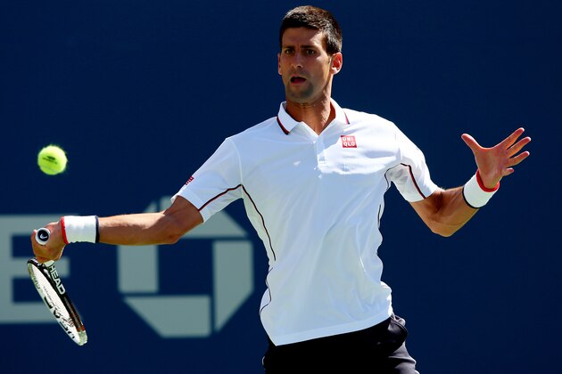 NEW YORK, NY - AUGUST 28:  Novak Djokovic of Serbia returns a shot against Paul-Henri Mathieu of France during their men's second round match on Day Four of the 2014 US Open at the USTA Billie Jean King National Tennis Center on August 28, 2014 in the Flushing neighborhood of the Queens borough of New York City.  (Photo by Elsa/Getty Images)