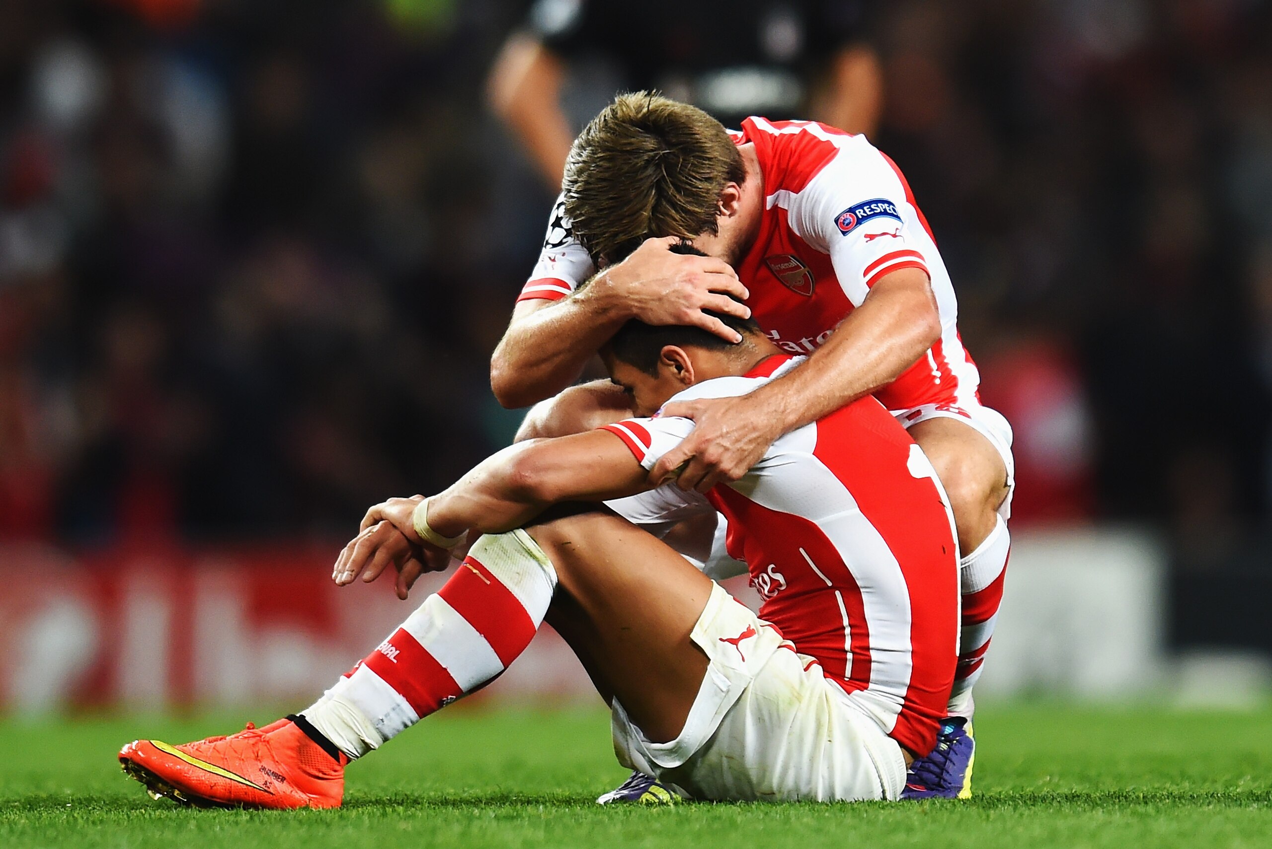 LONDON, ENGLAND - AUGUST 27:  Alexis Sanchez (L) of Arsenal celebrates with team mate Nacho Monreal of Arsenal at the end of the UEFA Champions League Qualifier 2nd leg match between Arsenal and Besiktas at the Emirates Stadium on August 27, 2014 in London, United Kingdom.  (Photo by Shaun Botterill/Getty Images)