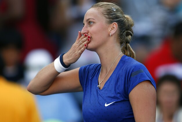 Petra Kvitova, of the Czech Republic, blows kisses to the crowd after defeating Petra Cetkovska, of the Czech Republic, during the second round of the 2014 U.S. Open tennis tournament, Thursday, Aug. 28, 2014, in New York. (AP Photo/Matt Rourke)