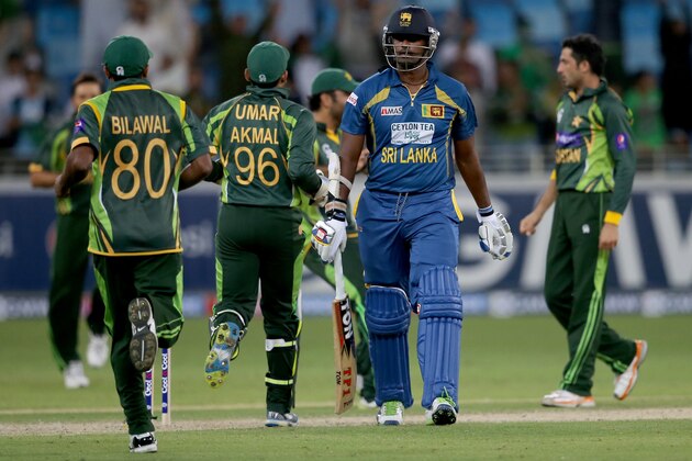 DUBAI, UNITED ARAB EMIRATES - DECEMBER 20:  Thisara Perera of Sri Lanka walks of the field after being dismissed during the second One-Day International (ODI ) match between Sri Lanka and Pakistan at the Dubai Sports City Cricket Stadium on December 20, 2013 in Dubai, United Arab Emirates.  (Photo by Francois Nel/Getty Images)
