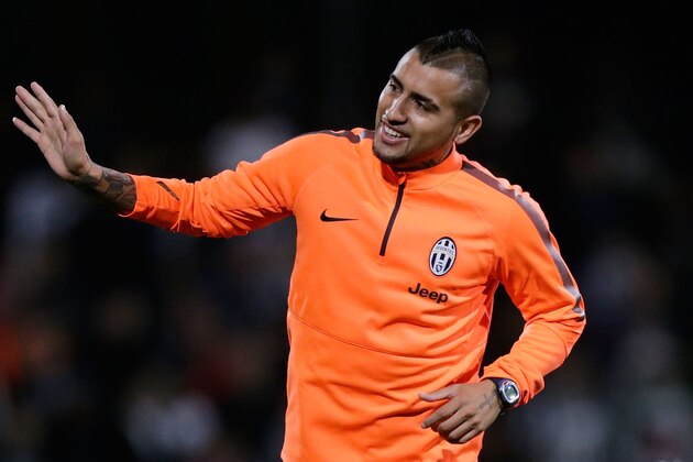 SYDNEY, AUSTRALIA - AUGUST 09:  Arturo Vidal waves to fans during a Juventus training session at WIN Jubilee Stadium on August 9, 2014 in Sydney, Australia.  (Photo by Mark Metcalfe/Getty Images)