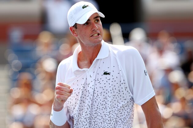 NEW YORK, NY - AUGUST 26:  John Isner of the United States celebrates after defeating Marcos Giron of the United States to win their men's singles first round match on Day Two of the 2014 US Open at the USTA Billie Jean King National Tennis Center on August 26, 2014  in the Flushing neighborhood of the Queens borough of New York City.  (Photo by Elsa/Getty Images)